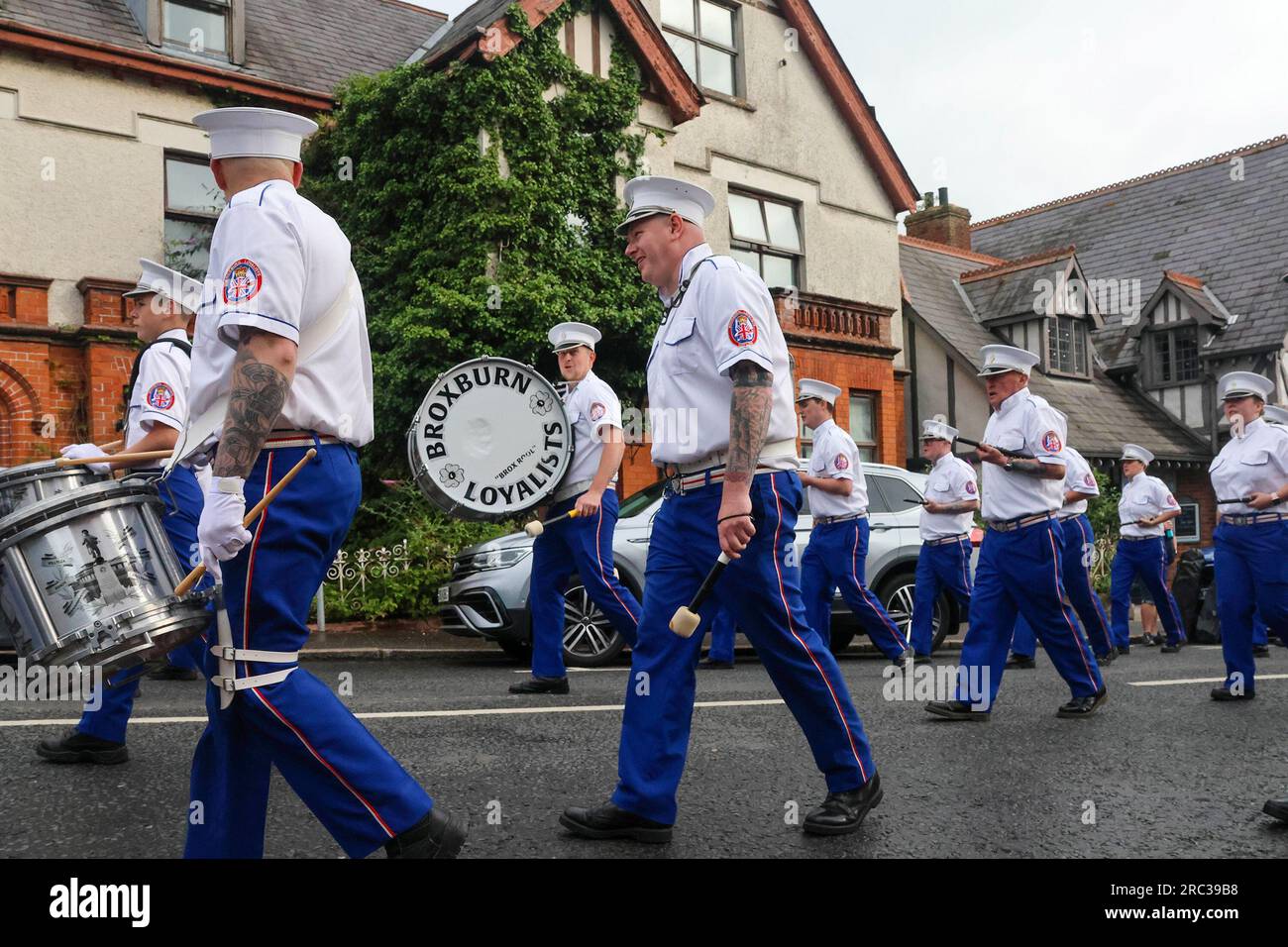 Lurgan, County Armagh, Northern Ireland.12 Jul 2023. The Twelfth of July is marked by Orange Order parades across Northern Ireland. Lurgan District left their headquarters at Brownlow House before parading up the town to the war memorial ahead of the main County Armagh demonstration being held in the town this year.The parades across Northern Ireland mark the victory of William of Orange over James at the Battle of the Boyne in 1690. Credit: CAZIMB/Alamy Live News. Stock Photo