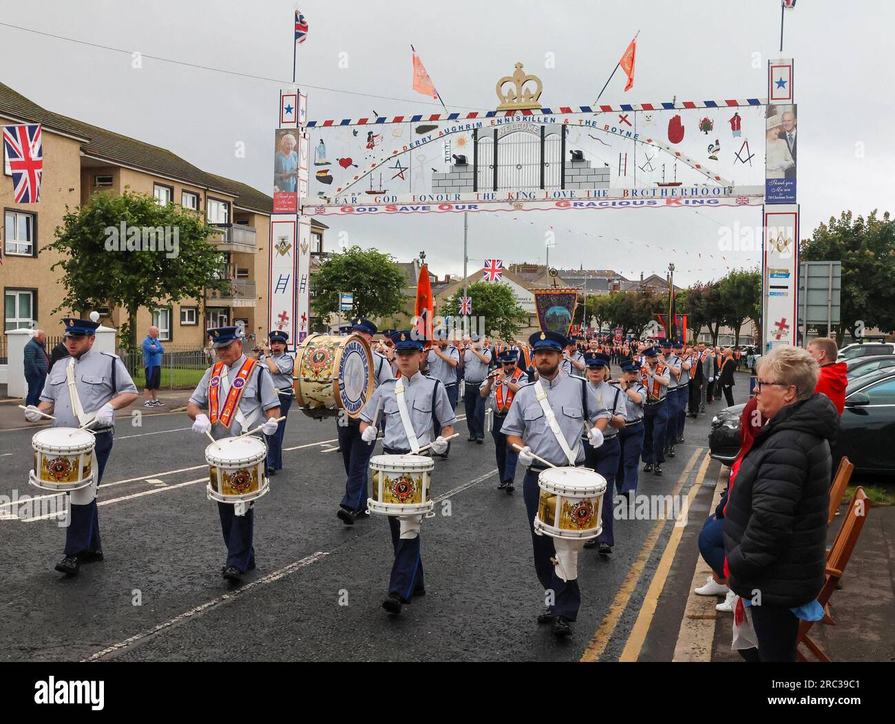 Lurgan, County Armagh, Northern Ireland.12 Jul 2023. The Twelfth of July is marked by Orange Order parades across Northern Ireland. Lurgan District left their headquarters at Brownlow House before parading up the town to the war memorial ahead of the main County Armagh demonstration being held in the town this year.The parades across Northern Ireland mark the victory of William of Orange over James at the Battle of the Boyne in 1690. Credit: CAZIMB/Alamy Live News. Stock Photo