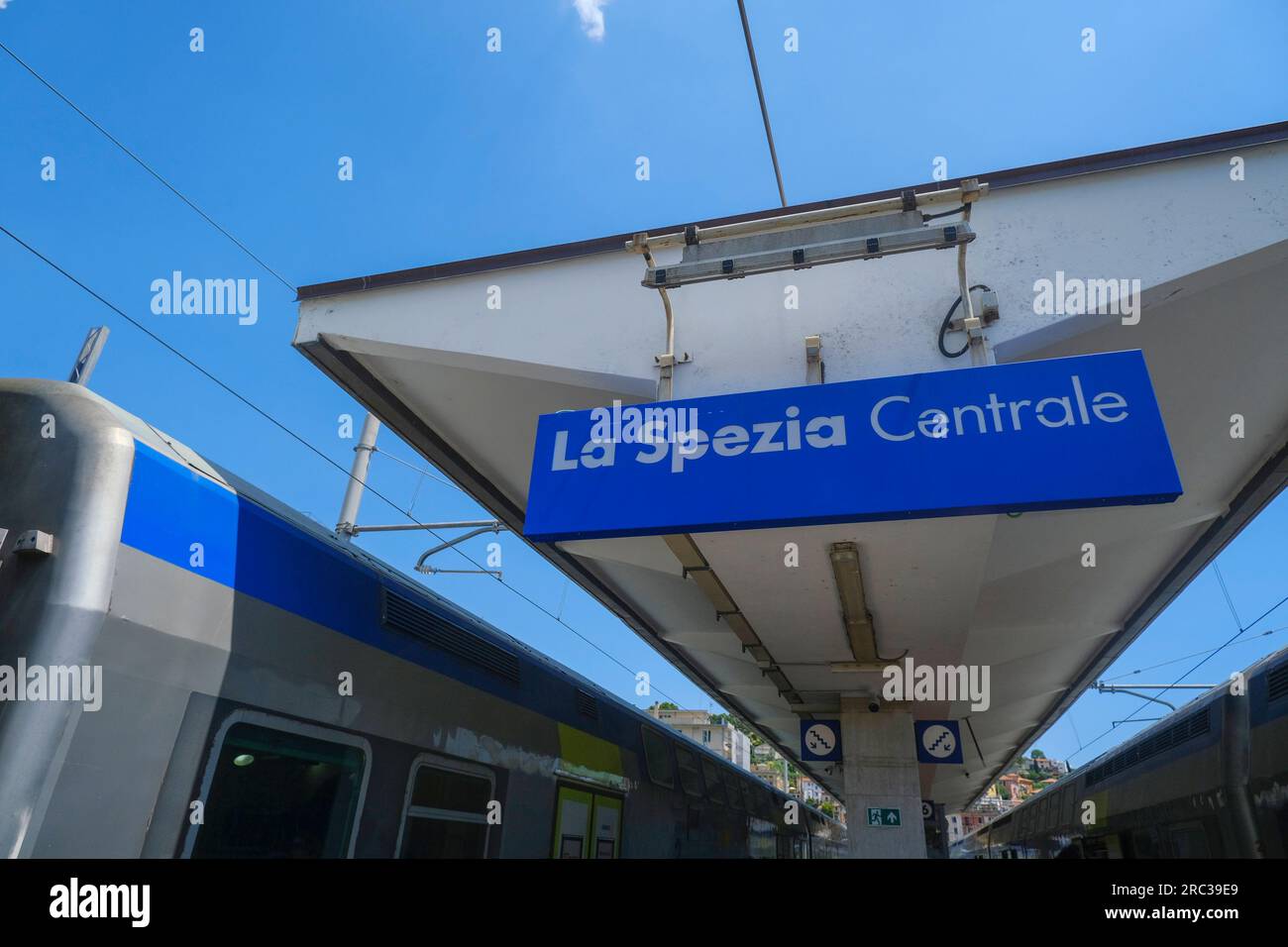 La Spezia Centrale sign on the railway station across the trains and station infrastructure Stock Photo