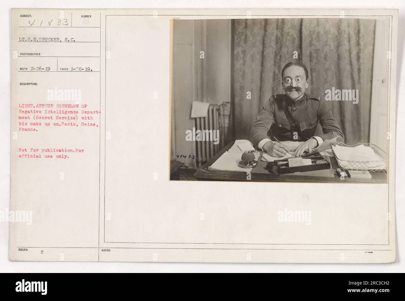 Lieutenant Arthur Hornblow, a Secret Service officer in the Intelligence Department, is captured in this photograph wearing makeup for an undercover operation. The photo was taken in Paris, France on January 26, 1919. It is not intended for publication, but rather for official use only. Stock Photo