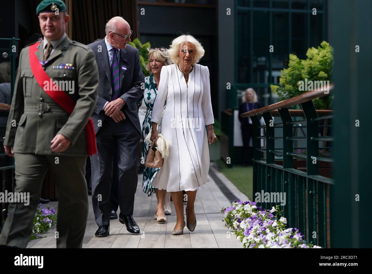 Queen camilla with aeltc chairman, ian hewitt as she arrives for her