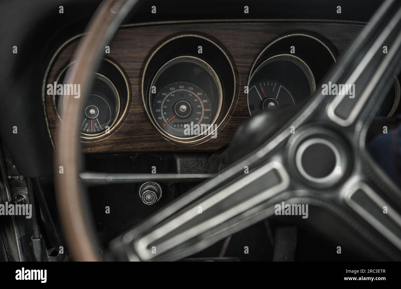 Classic Car Vintage Dashboard and Steering Wheel. Automotive History Theme. Stock Photo