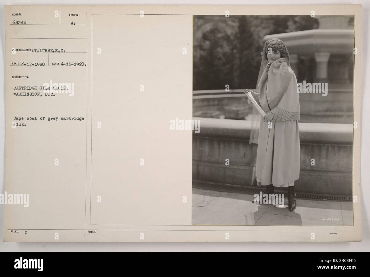 This image features a cape coat made of grey cartridge silk fabric ...