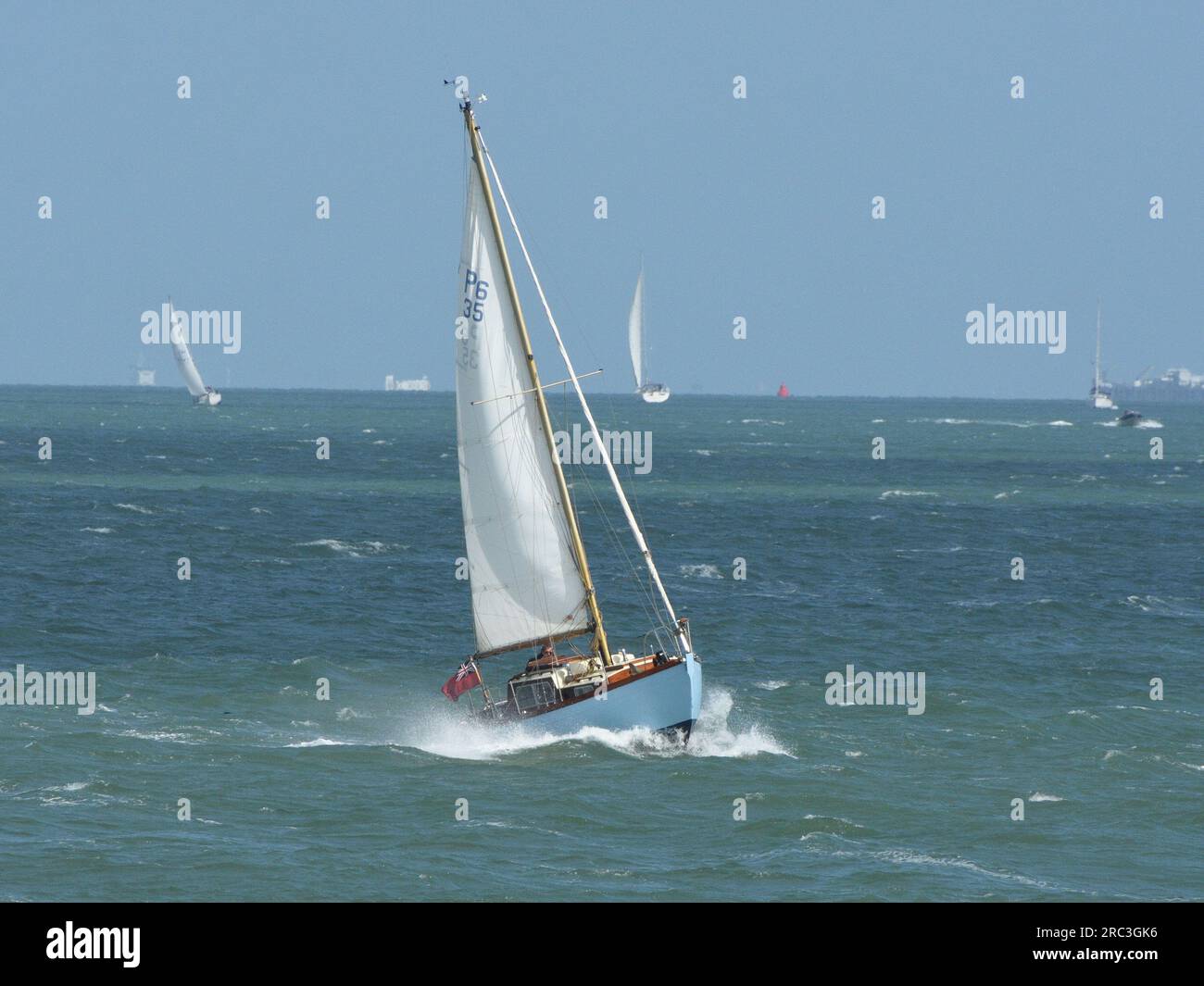 Wooden sailing boat on the Solent near the Isle of Wight.UK Stock Photo