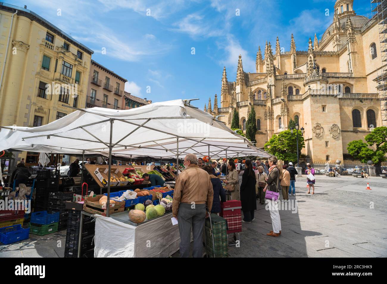 Segovia market, view in summer of Spanish people shopping for food at the outdoor market sited in the historic Plaza Mayor in Segovia, Spain Stock Photo