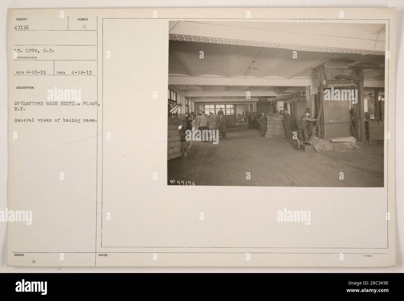 General view of the baling room at Operations Base Section Plant in New York. This photograph, taken on April 14, 1919, by Lieutenant Lyon, shows the room where baling activities were carried out. The image has the subj ect number 47176 and was received on April 16, 1919. Stock Photo