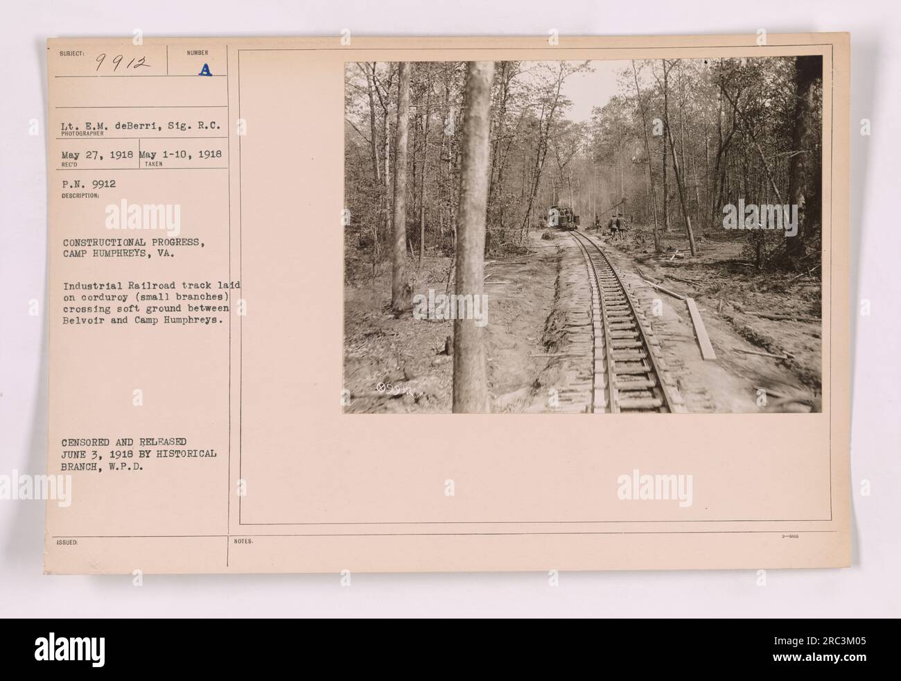 Image shows construction progress at Camp Humphreys, VA during World War One. The photograph depicts an industrial railroad track laid on corduroy (small branches), crossing soft ground between Belvoir and Camp Humphreys. The photograph was taken by Lieutenant E.M. deBerri, Signal Corps, between May 1-10, 1918 and was censored and released by the Historical Branch on June 3, 1918. Stock Photo