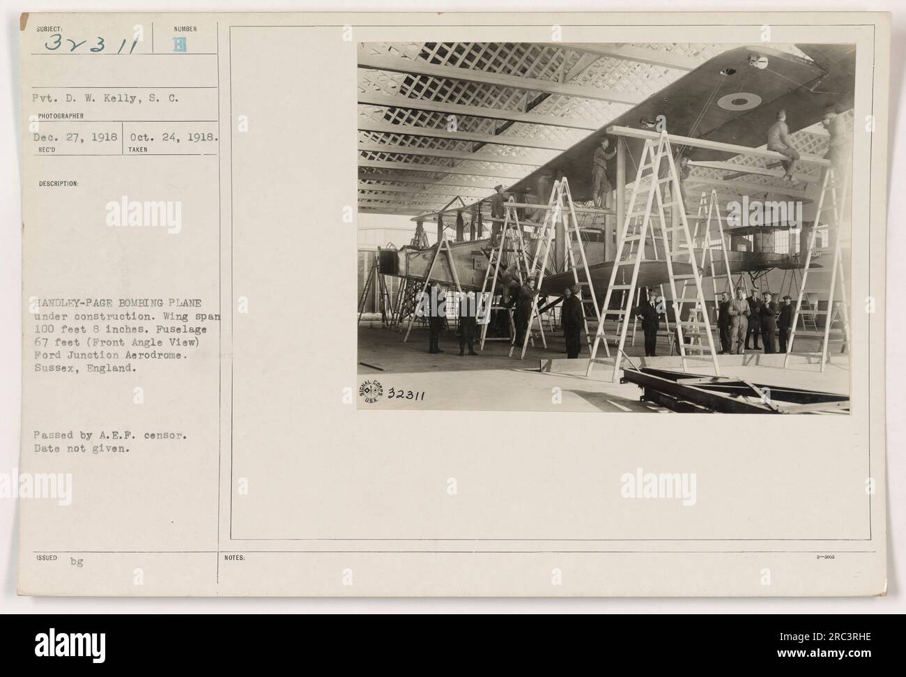 'Photograph of Handley-Page Bombing Plane under construction at Ford Junction Aerodrome, Sussex, England. The plane has a wing span of 100 feet 8 inches and a fuselage of 67 feet. Taken by Pvt. D.W. Kelly on October 24, 1918. Authorized by A.E.P. censor. Reference number 111-SC-32311. ' Stock Photo