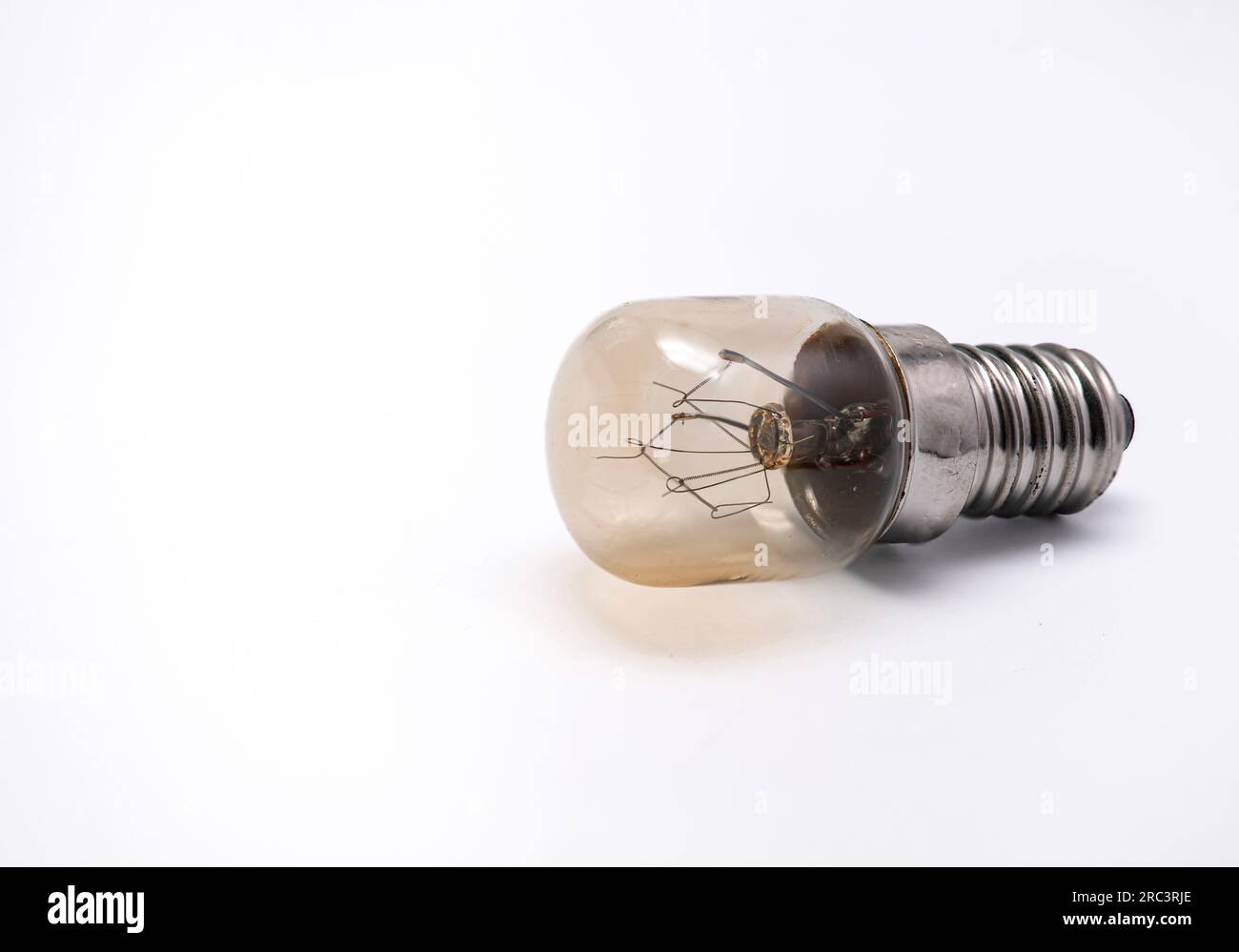 Lightbulb from a salt lamp isolated on a white background. Stock Photo