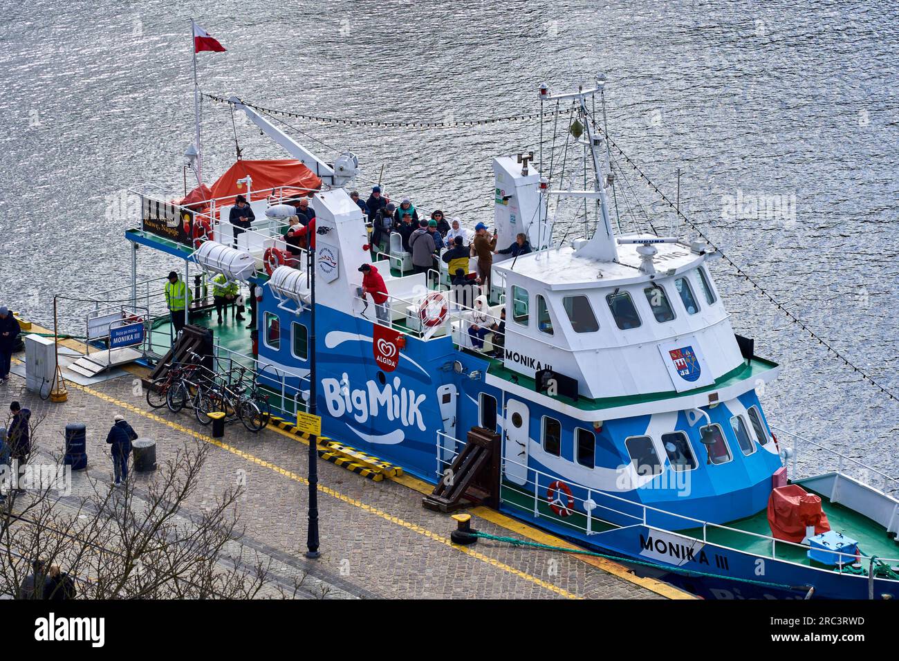 Kolberg, Poland, April 20, 2023: The pleasure boat Monoka III with tourists boarding the ship for a ride, in the port of the Polish city of Kołobrzeg Stock Photo