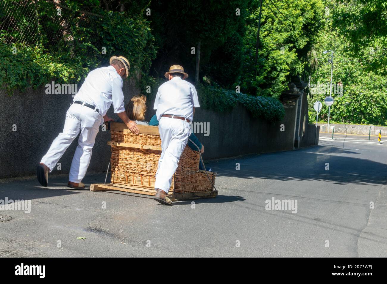 Toboggan Ride on Traditional Wicker Basket Sledges in Monte Funchal, Madeira island, Portugal Stock Photo