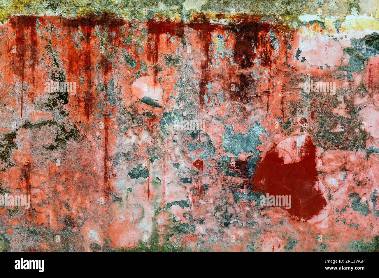Old wall, peeling orange paint colorful texture Stock Photo