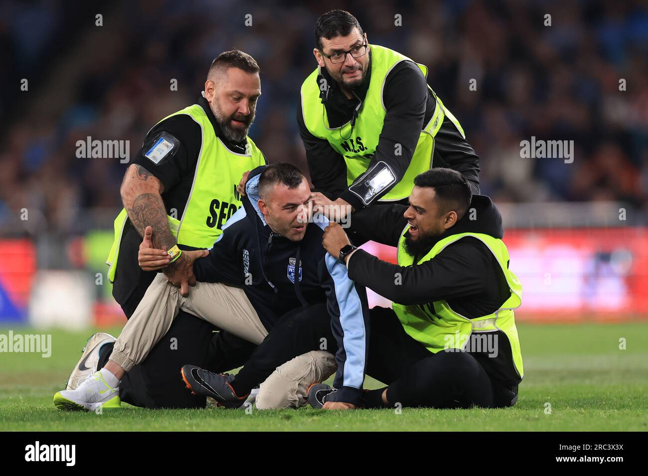 Sydney, Australia. 12th July, 2023. A pitch invader is apprehended by security during game three Sydney, Australia. 12th July, 2023. A pitch invader is apprehended by security during game three