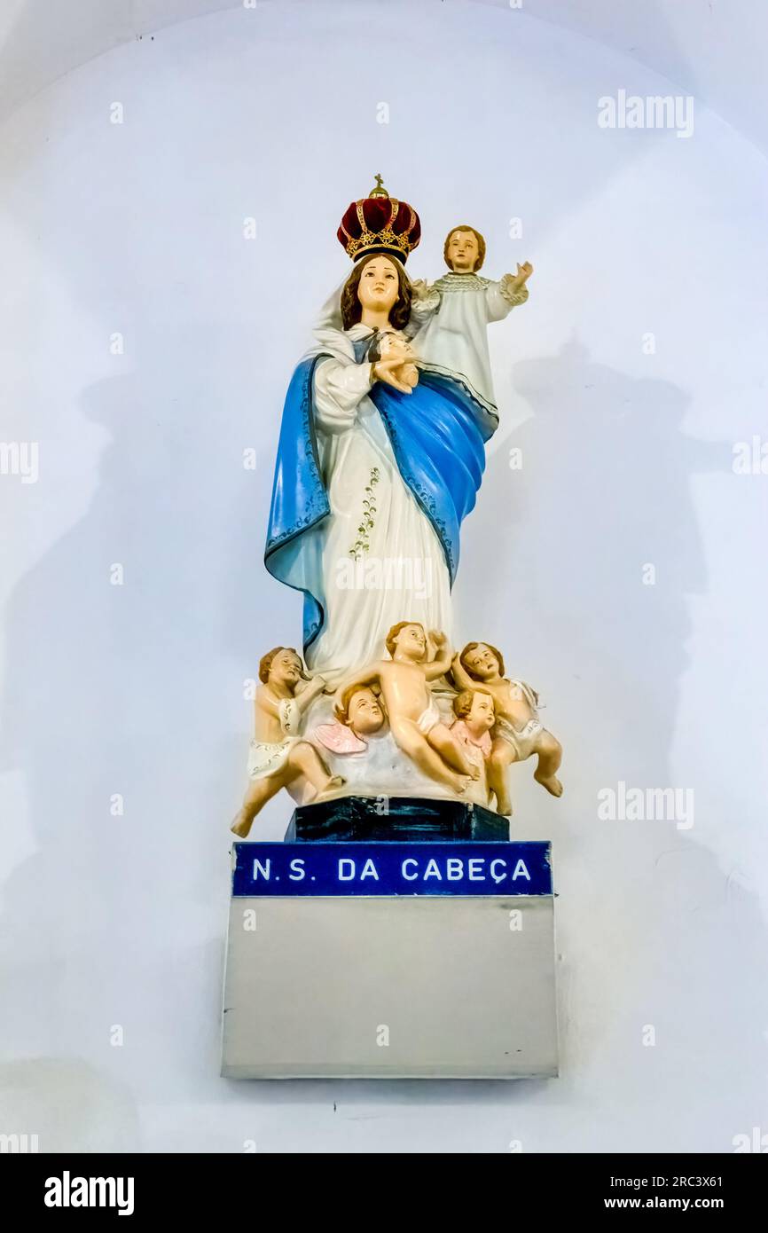 Rio de Janeiro, Brazil - June 15, 2023: Statue of the Virgin Mary holding a child with a crown