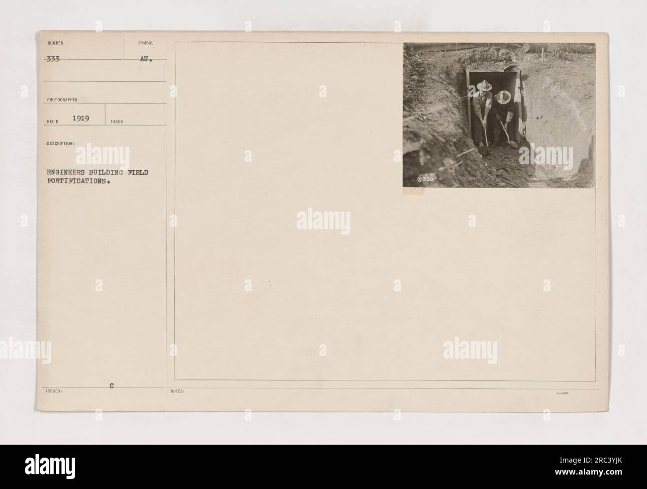 American engineers constructing field fortifications during World War One in 1919. The photograph, labeled as NUNDER -333, captures the efforts of the engineers as they work on strengthening defenses. This image highlights the crucial role played by these engineers in protecting military installations and strategic areas. Stock Photo