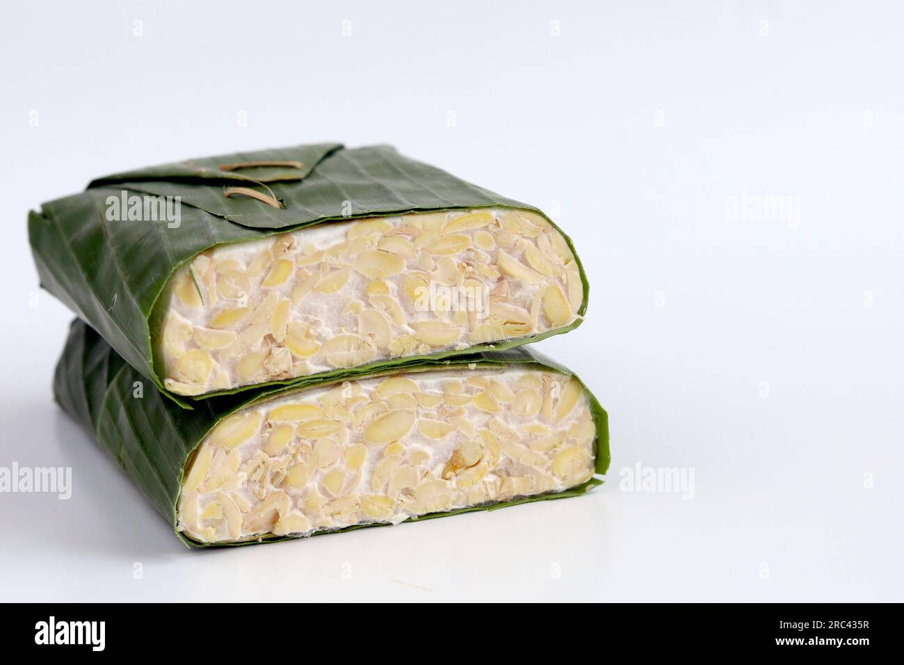 a slice of raw tempeh or tempe ,Indonesian traditional food made from