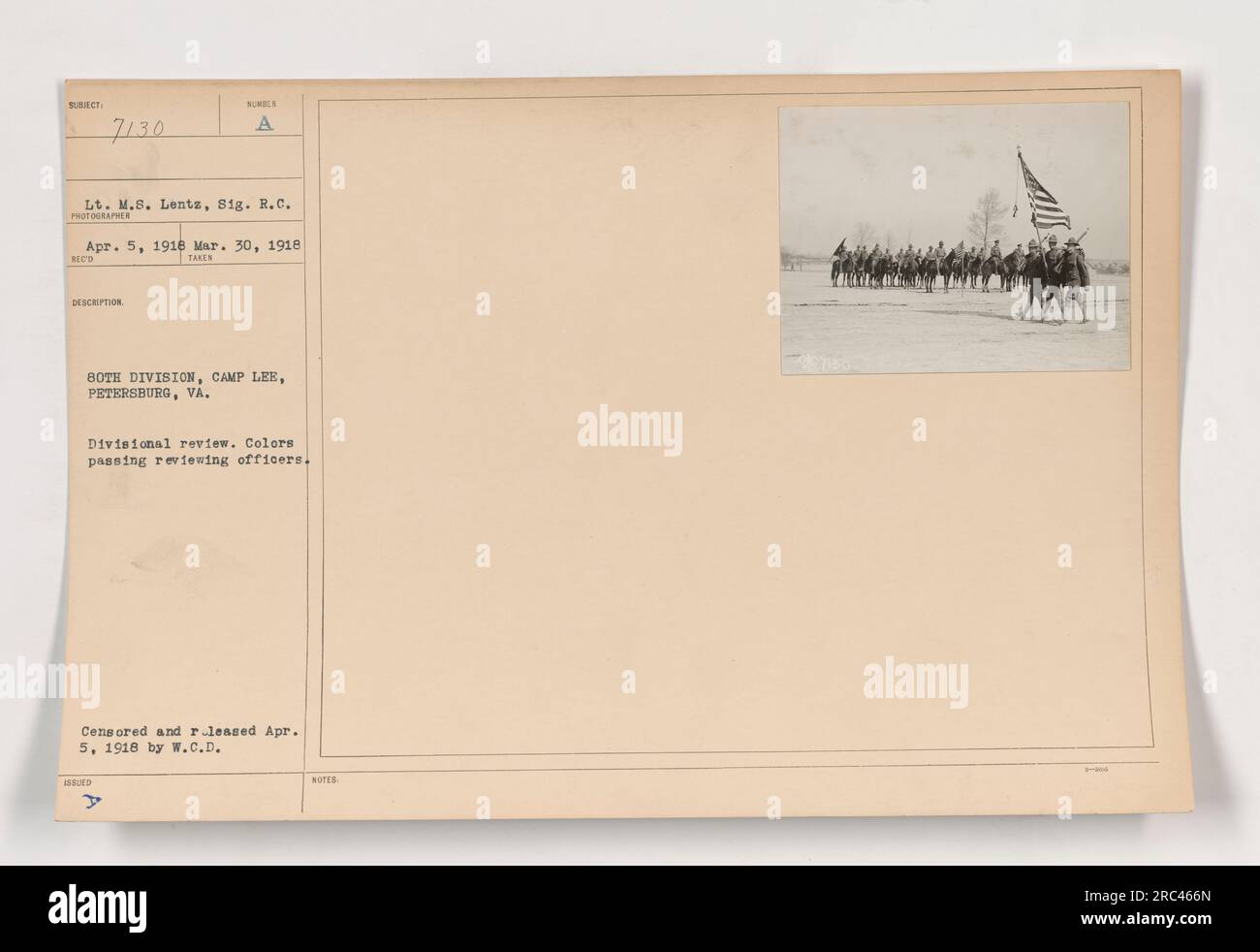 Lt. M.S. Lentz of the Signal Corps photographed the Divisional review at Camp Lee, Petersburg, VA. The image shows the colors passing reviewing officers during the review. The photograph was taken between March 30 and April 5, 1918. It was censored and released on April 5, 1918, by W.C.D. HOTE. Stock Photo