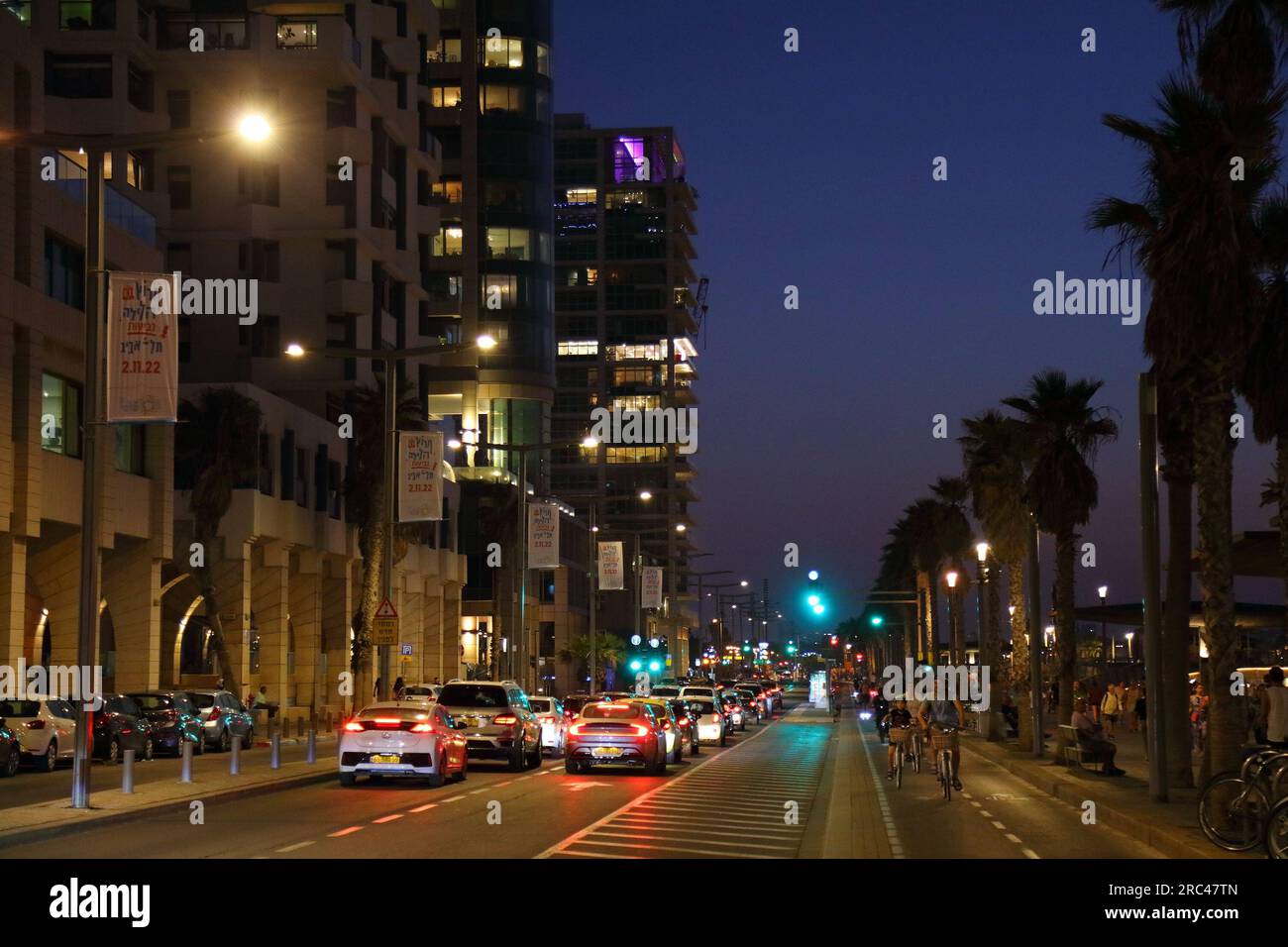 TEL AVIV, ISRAEL - NOVEMBER 3, 2022: People ride bicycles along beachfront promenade (Tayelet) in Tel Aviv, Israel. Tel Aviv is the economic and techn Stock Photo