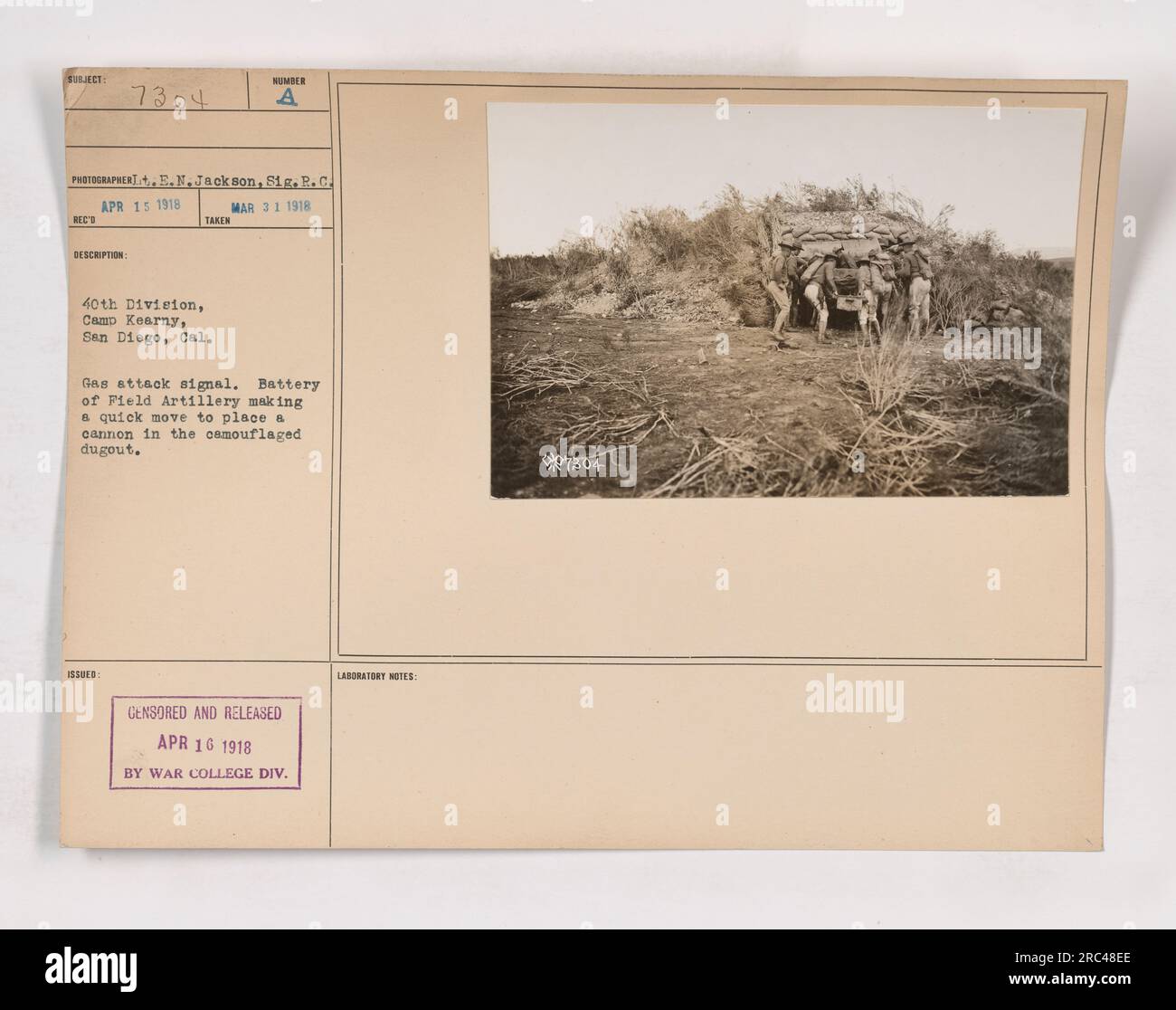 Image showing a gas attack signal at Camp Kearney, San Diego, CA during World War One. The photograph captures a battery of Field Artillery maneuvering a cannon to a camouflaged dugout. Taken on March 31, 1918 by photographer E.N. Jackson, Sig.R.C. and issued with the number 7304. Censored and released on April 16, 1918 by the War College Division Laboratory. Stock Photo