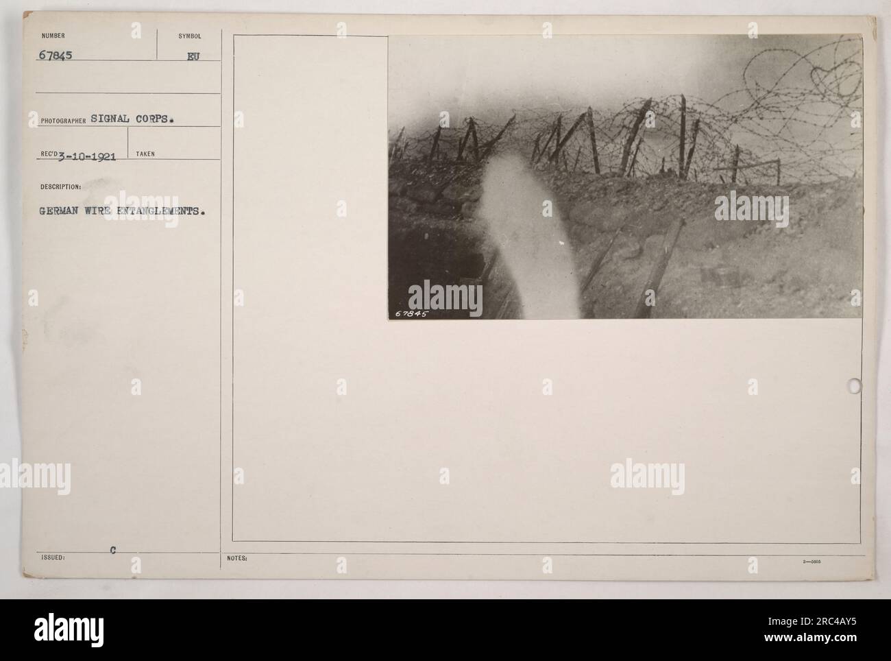 German soldiers construct and maintain wire entanglements to fortify