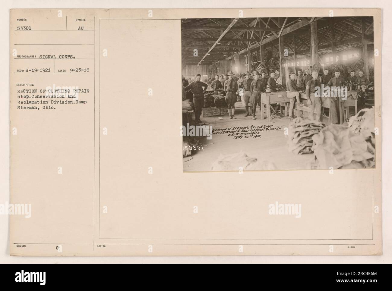 A section of the clothing repair shop in the Conservation and Reclamation Division at Camp Sherman, Ohio. The photograph shows workers engaged in repairs. This image was taken on September 25, 1918, and was issued by the Signal Corps. Stock Photo