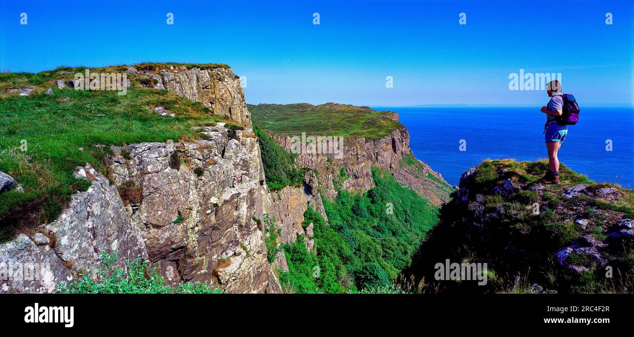 Hill walker at Fair Head, Ballycastle, County Antrim, Northern Ireland Stock Photo