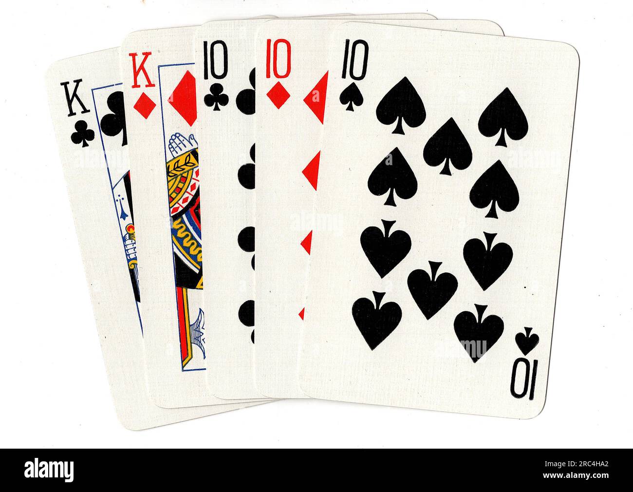 A poker hand of playing cards showing a full house of tens and kings on