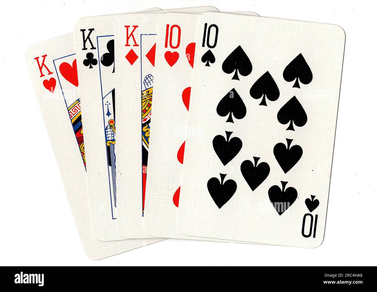 A poker hand of playing cards showing a full house of kings and tens on