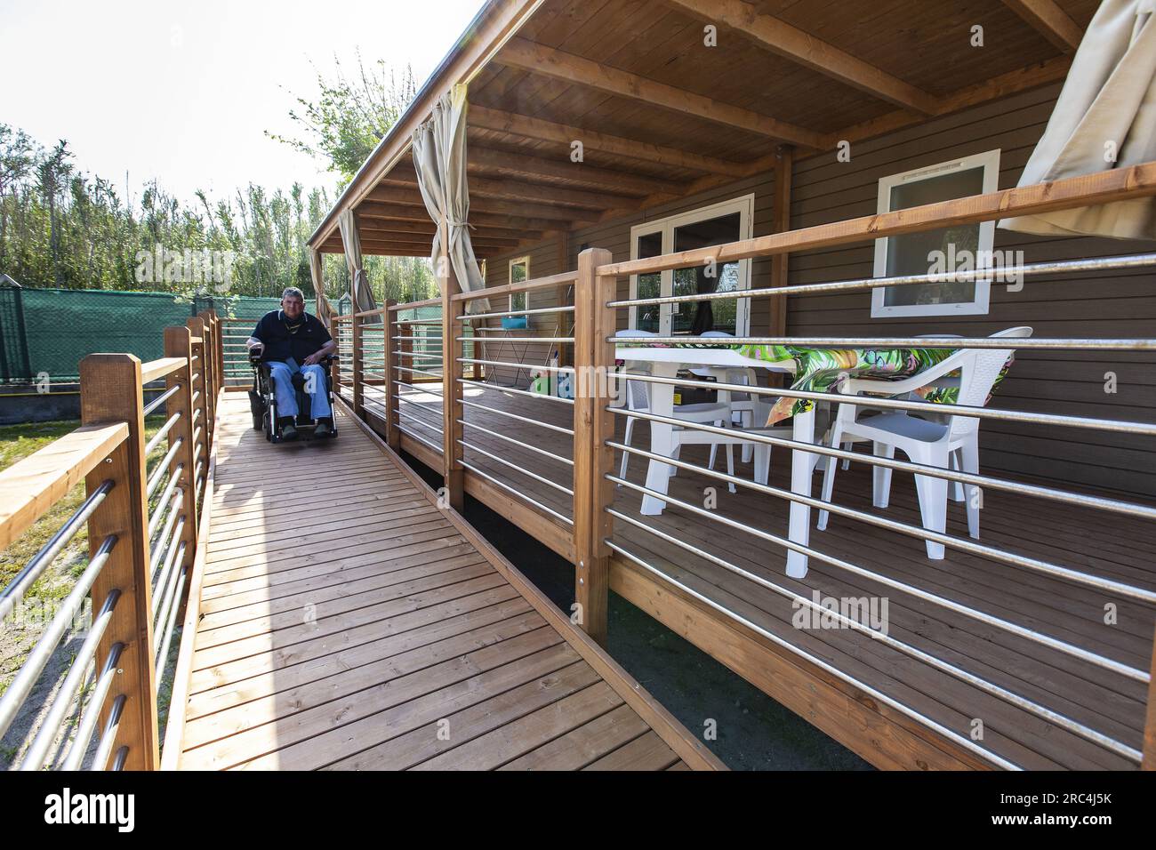 disabled person on the access ramp to the house Stock Photo