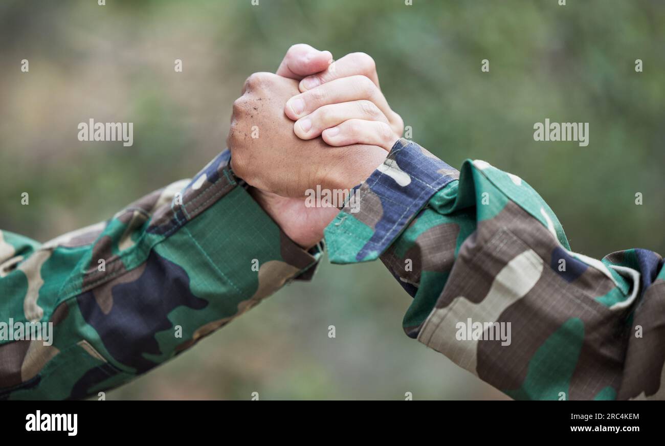 People, army and handshake for partnership, teamwork or deal in war ...