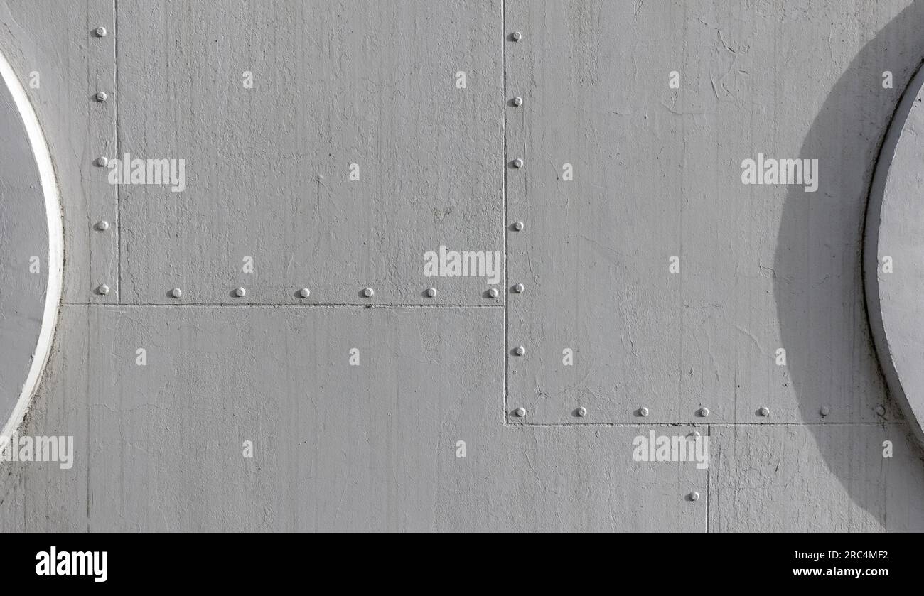Gray industrial background wall or banner with rivets and portholes ...