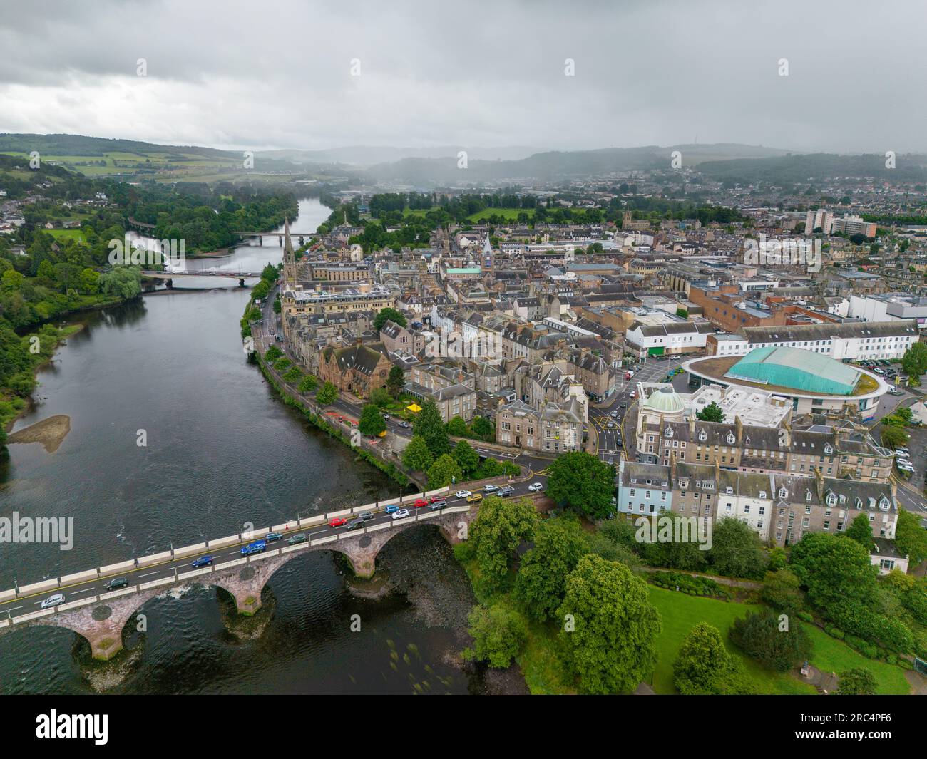 Aerial drone photo of the city Perth in Scotland. There is a large river running along the city centre with a bridge. Stock Photo