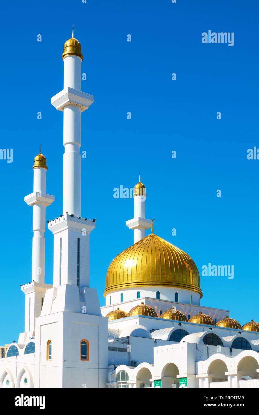 Golden dome and tall minarets of Abu Nasr Al-Farabi mosque in Astana, Kazakhstan Stock Photo