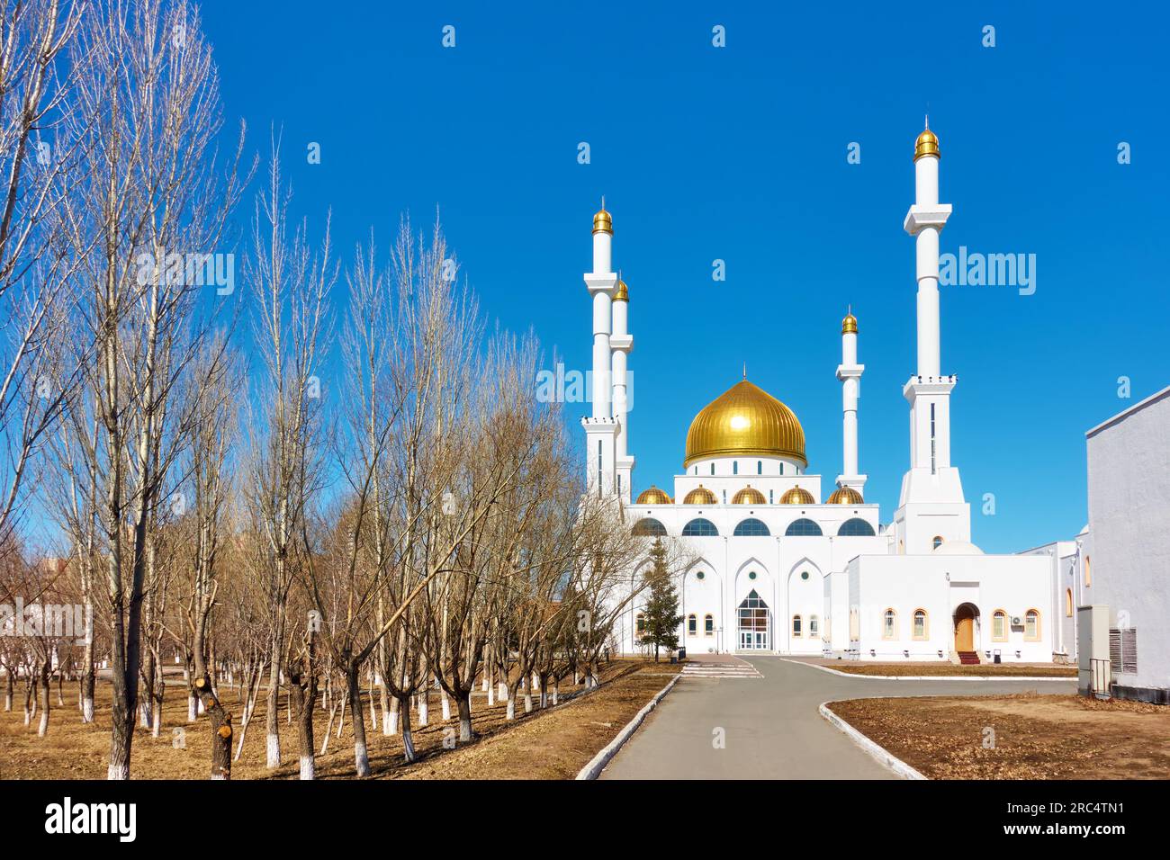 Mosque with tall minarets in during Ramadan month in the spring. Abu Nasr Al-Farabi mosque in Astana, Kazakhstan Stock Photo