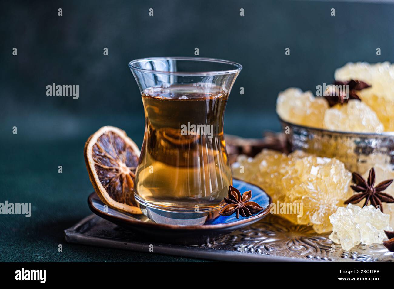 Iranian crystal rock candy and spices in the vintage metal cup Stock Photo