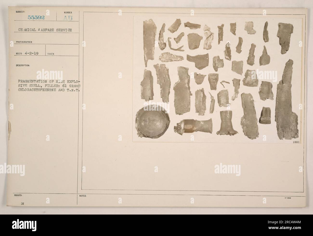 The image shows the fragmentation of a high explosive shell during World War One. The filler of the shell consisted of 61 grams of chloracetophenone and T.N.T. The photograph was taken by a Chemical Arpare Service photographer and was received on April 2, 1919. The description number issued for this image is Fragmentation of High Explosive Shell. Stock Photo