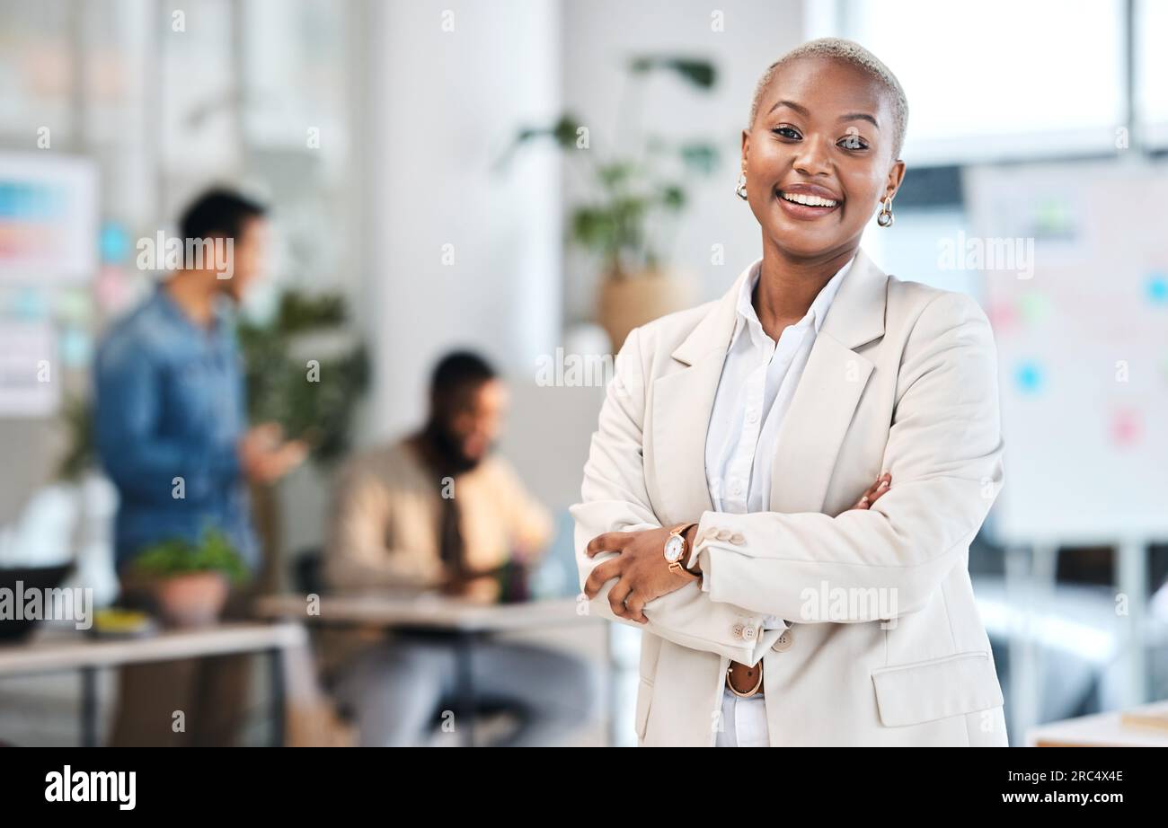 Portrait, smile and black woman in modern office with arms crossed ...