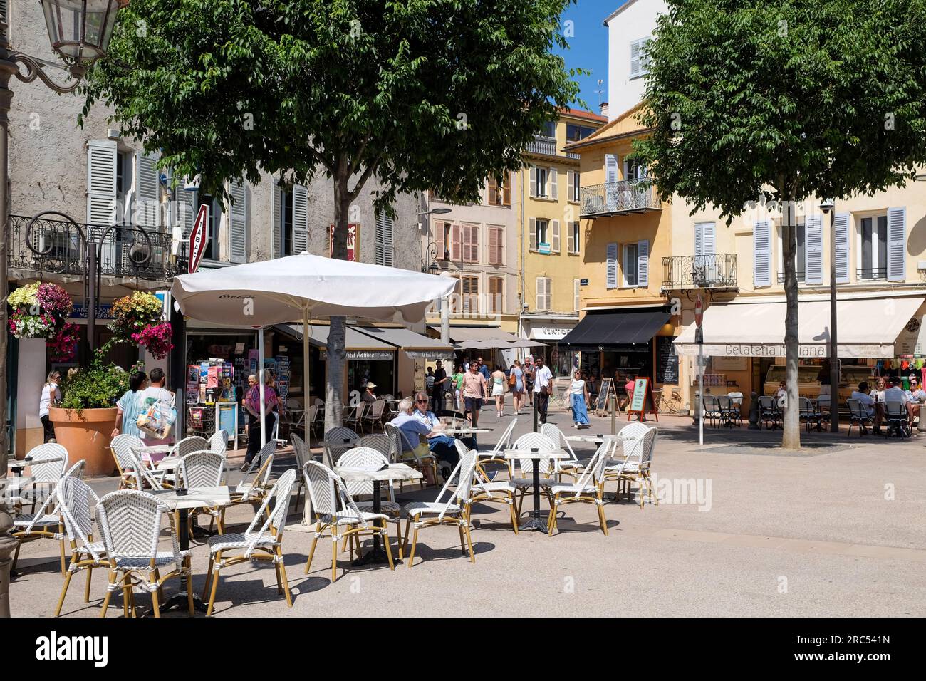 Cafes and outdoor seating in summer at Place Nationale, Antibes, Cote d'Azur, France Stock Photo