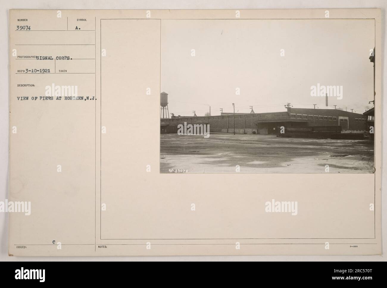 This photograph shows a view of the piers at Hoboken, New Jersey. The image was taken by a photographer from the Signal Corps during World War One. The picture has a symbol issued, identified as 'A' in the description. The photo was received on March 10, 1921. Stock Photo