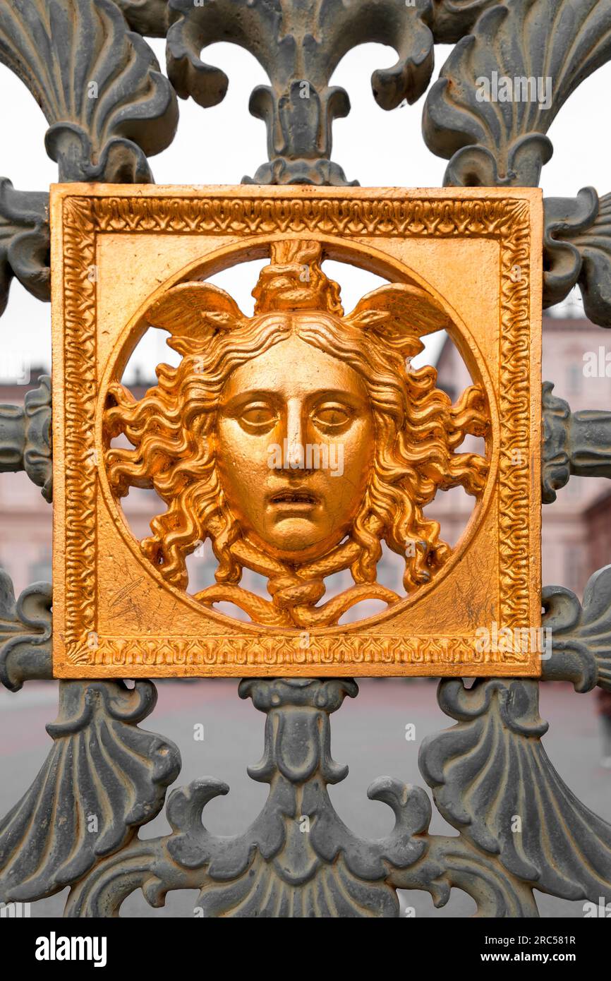 Gold colored bas relief decoration on metal fences Stock Photo Alamy