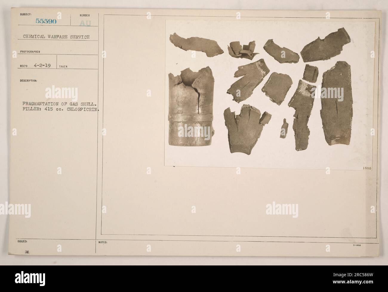 Image showing the fragmentation of a gas shell during World War I. The shell contained 415 cc of chlorpicrin, a chemical used in warfare. This photograph was taken by a photographer from the Chemical Warfare Service on April 2, 1919. Associated notes indicate the gas shell was issued under notes RI 1566. Stock Photo