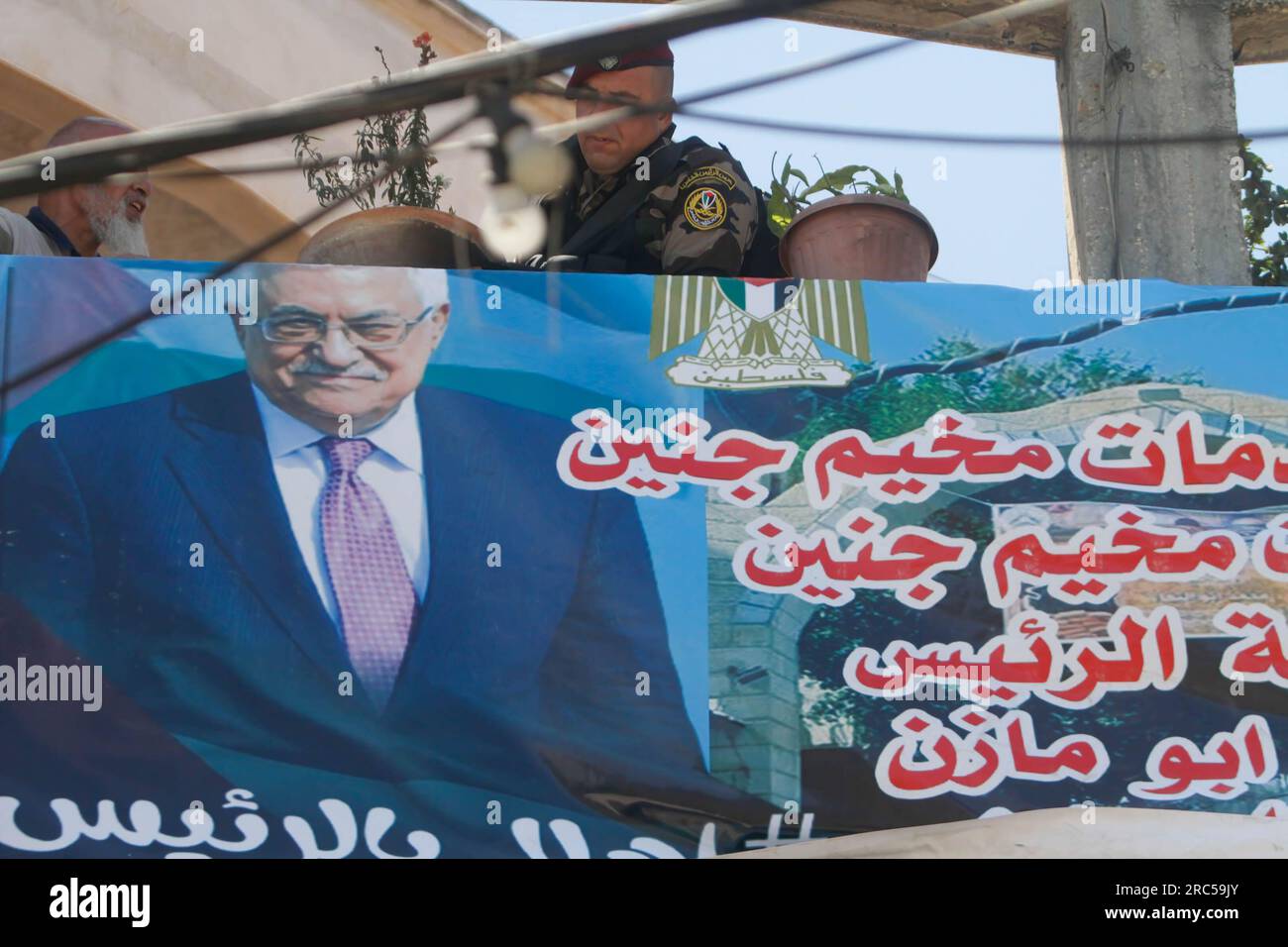 Jenin, Palestine. 12th July, 2023. A banner with Palestinian President Mahmoud Abbas hangs in the alleys of the Jenin refugee camp, ahead of his visit to the West Bank city of Jenin. (Photo by Nasser Ishtayeh/SOPA Images/Sipa USA) Credit: Sipa USA/Alamy Live News Stock Photo