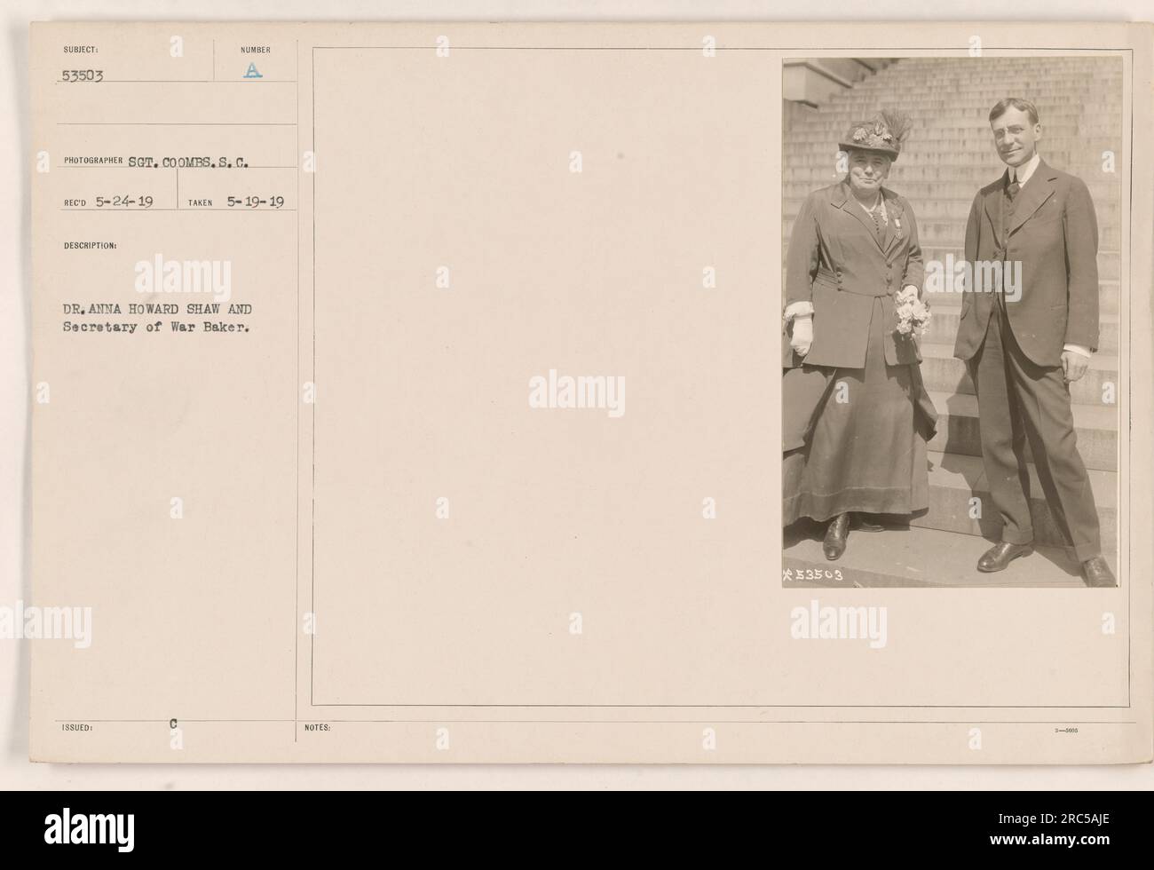 Dr. Anna Howard Shaw and Secretary of War Baker are seen wearing gloves in this photograph, taken on May 19, 1919. The photographer is Sot. Coombs, while the description number is 53503. These details were recorded on May 24, 1919. Stock Photo