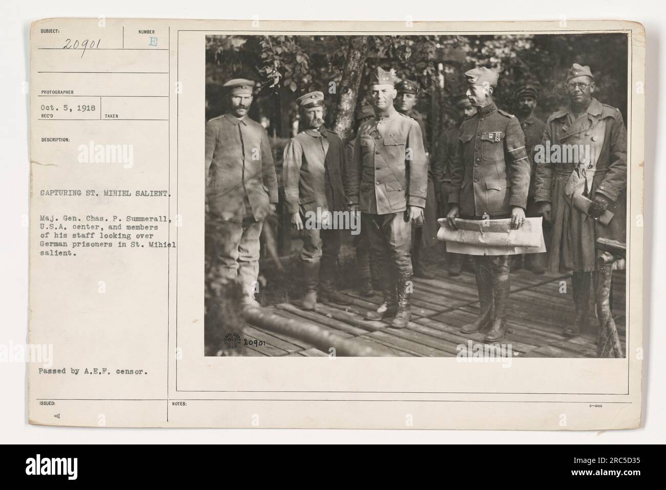 Major General Charles P. Summerall, alongside his staff, examines German prisoners captured during the capture of the St. Mihiel Salient. This historical photograph was taken on October 5, 1918, and has been verified by the A.E.P. censor. Stock Photo