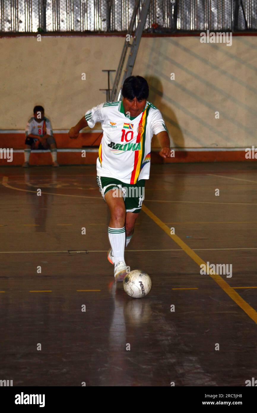 LA PAZ, BOLIVIA, 30th October 2012. Bolivian president Evo Morales runs with the ball while playing for his Presidencia Team in a futsal tournament in La Paz. Stock Photo