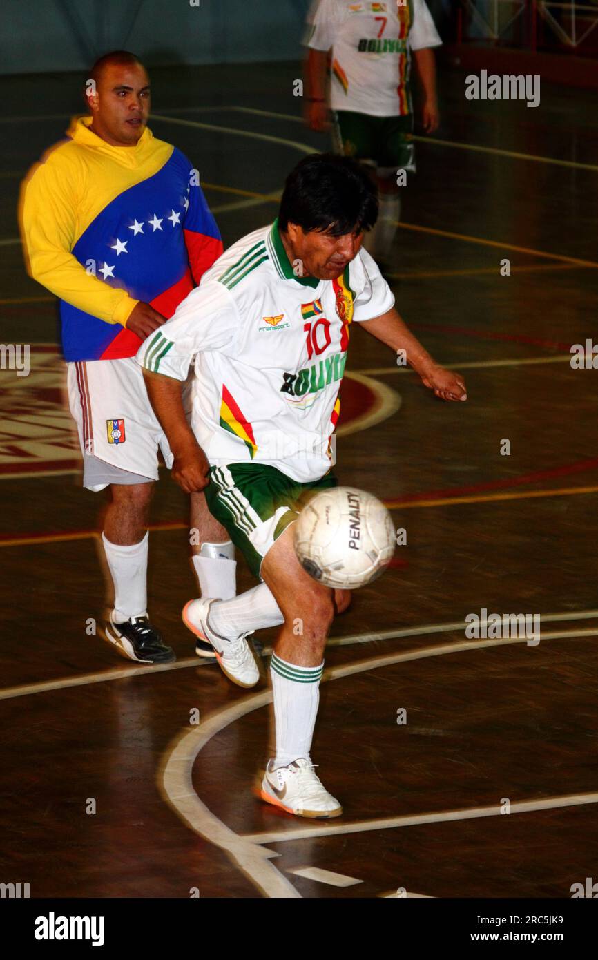 LA PAZ, BOLIVIA, 30th October 2012. Bolivian president Evo Morales runs with the ball while playing for his Presidencia Team against a team from the Venezuela Embassy in a futsal tournament in La Paz. Stock Photo