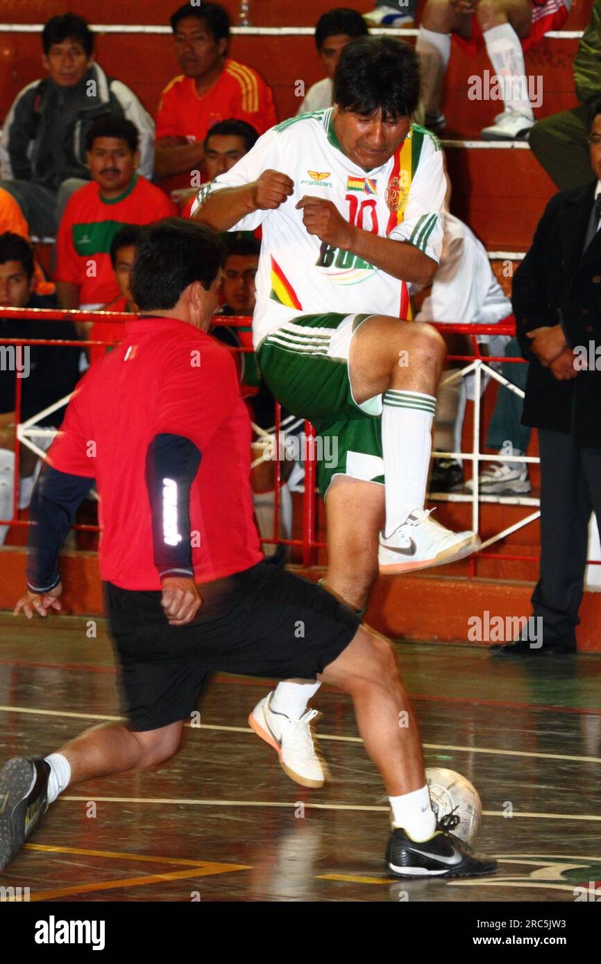 LA PAZ, BOLIVIA, 30th October 2012. Bolivian president Evo Morales challenges for the ball while playing for his Presidencia Team in a futsal tournament in La Paz. Stock Photo