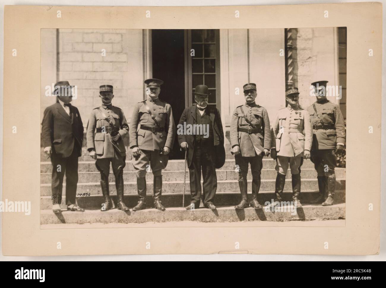 Soldiers loading ammunition onto a military vehicle during World War I ...