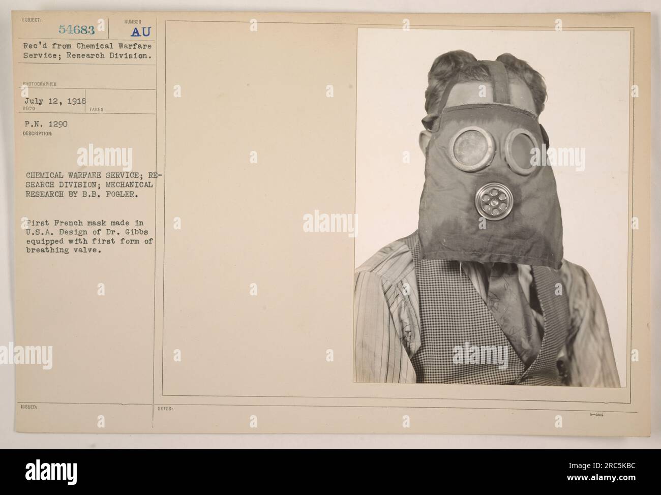 Photograph taken on July 12, 1918, showing the Mechanical Research conducted by B.B. Fogler at the Chemical Warfare Service; Research Division. It features the first French mask made in the U.S.A., based on the design of Dr. Gibbs, equipped with the initial form of a breathing valve. (Notes indicate 20, but no further context is given) Stock Photo