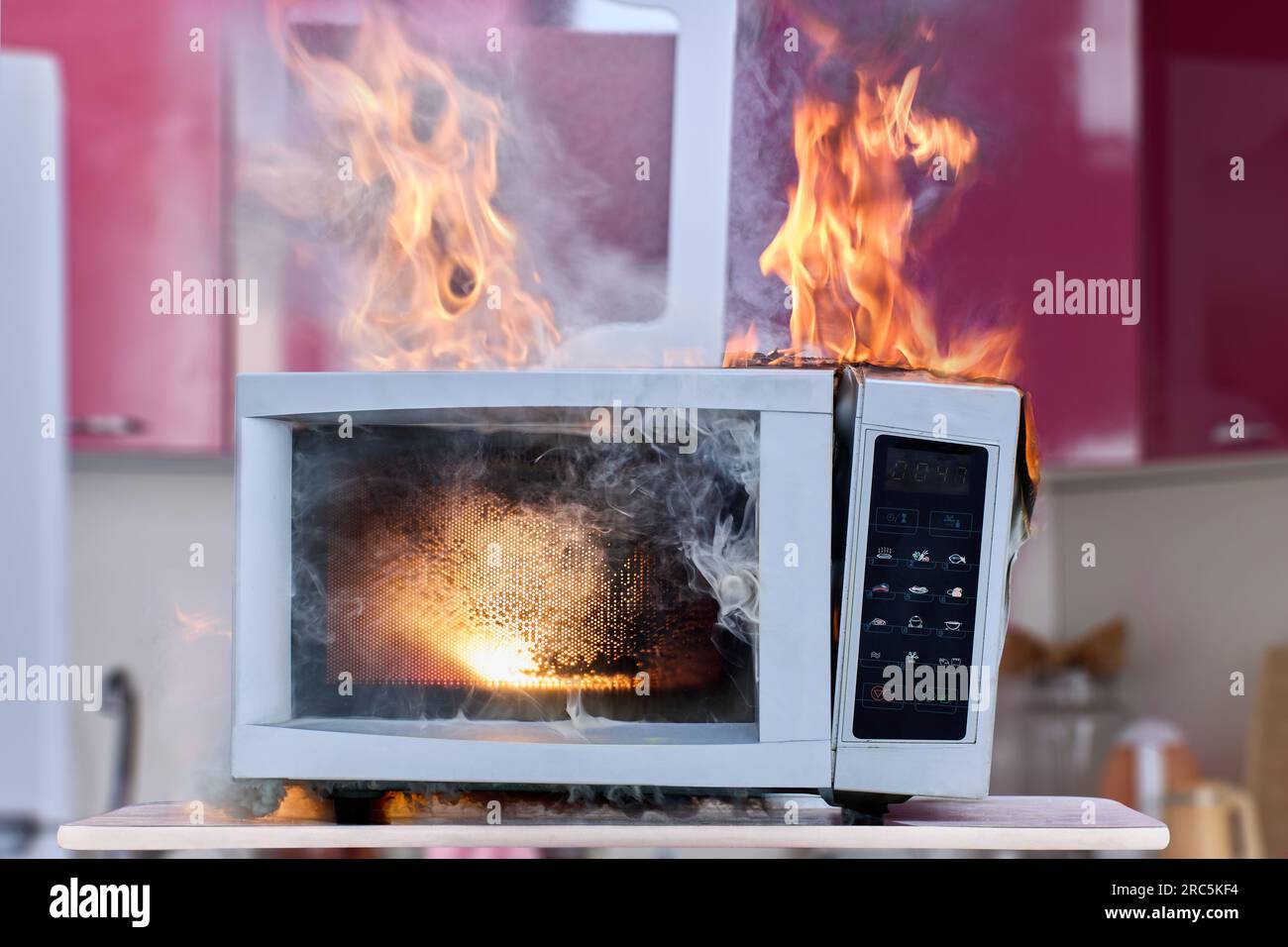 Household electrical fire in microwave oven, ignition of electrical